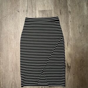 Black and white striped midi skirt with a wrap detail. Size: S